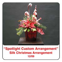 December Spotlight Christmas Flower Arrangement using Candy Canes,poinsettias, peppermints and pine