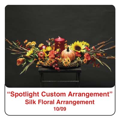October Spotlight Thanksgiving and Fall Centerpiece using a candle, pumpkin, cattails, roses, berries, artifical berries, sunflowers, and silk foliage