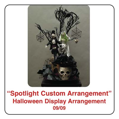 September Spotlight Halloween Arrangement and Display using skeletons, spiders, spider webs, a black tree, and zombies