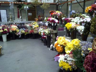 Buckets of bunched silk flowers